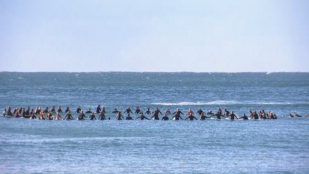 Surfers held a paddle out at Palm Beach in Sydney to honour Mark Sanguinetti, killed in a shark attack.