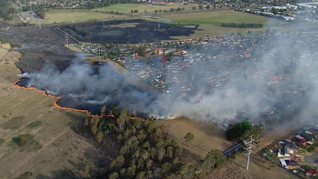 The fire in Minto is getting close to houses.