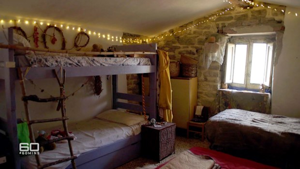 All five members of the family share a bedroom in this off-the-grid home.
