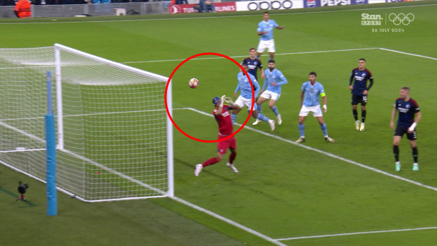 Copenhagen goalkeeper Kamil Grabara lets the ball slip through his hands into the goal.