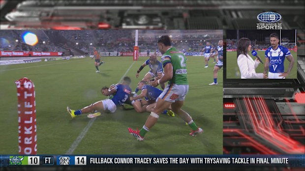 A replay of Enari Tuala's try-saver is shown while he's interviewed by Nine's Danika Mason after the Bulldogs' round three win over the Raiders.