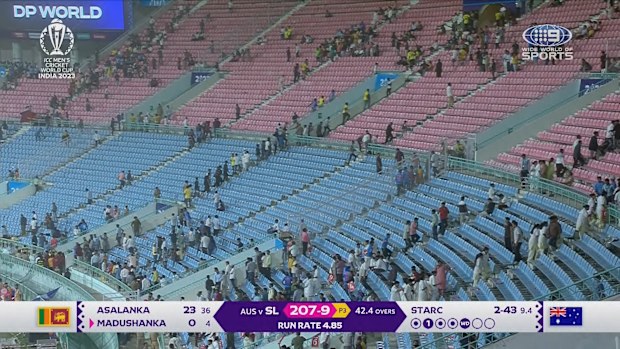 The crowd retreating after being told to move towards the top of the stands.