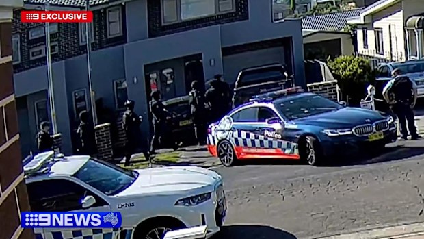 Exclusive pictures show of the moment Taskforce Falcon raid a home just hours after gangland violence erupted across Western Sydney yesterday.