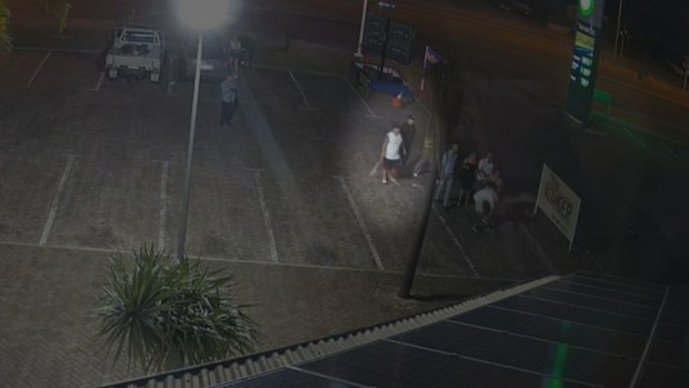 Footage shows Stephen Muckleston, in a white shirt and black shorts, with a cricket bat in his hands.