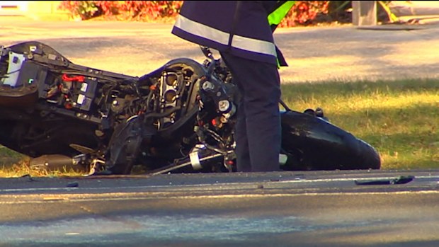 The motorcyclist, who police believe was not wearing a helmet, died on the road. Picture: 9NEWS