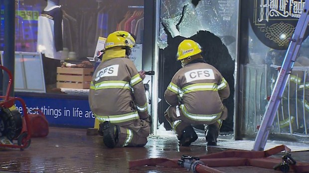 Security cameras have captured the moment a South Australian barber shop was caught up in a fire bomb attack.