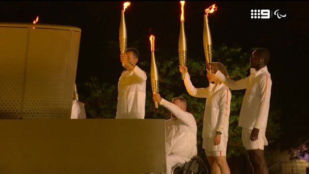 Paralympic flame is lit.