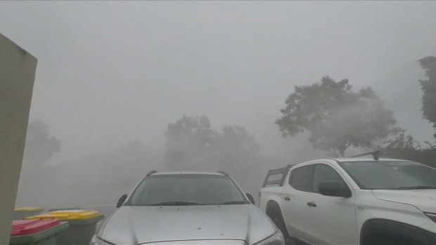 A dangerous thunderstorm has struck Brisbane bringing nearly 200km/h wind gusts and heavy rain.