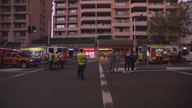 Flames and smoke can be seen coming from level 15 of the apartments on the corner of Liverpool and Oxford St in Darlinghurst.