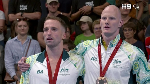 Aussies Tom Gallagher and Rowan Crothers throw their arms around each other.