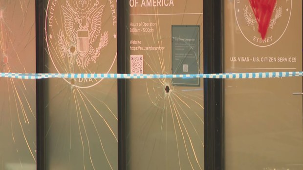 The US Consulate in Sydney has been vandalised with a sledgehammer and red paint in the early hours of this morning. 