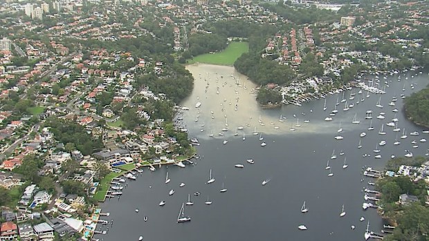 A burst pipe in Sydney's North Shore has cut off water to residents, caused flooding and sent murky water seeping into the harbour. 