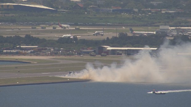 The fire appeared to burn through grass alongside runway 3 at Sydney Airport.