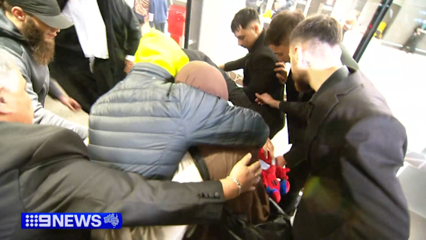 Zahra Ahmad was flanked by supporters as she left Melbourne Airport on Thursday.