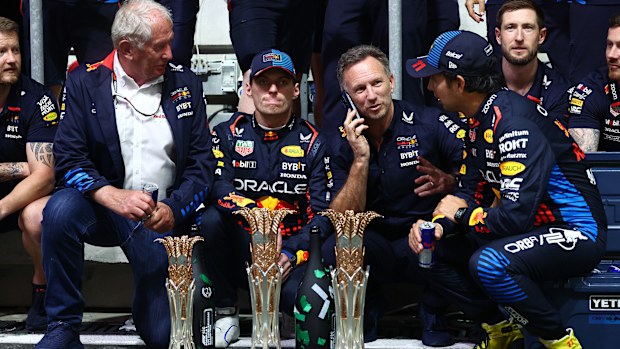 Red Bull Racing team consultant Dr Helmut Marko, race winner Max Verstappen, team principal Christian Horner and Sergio Perez.