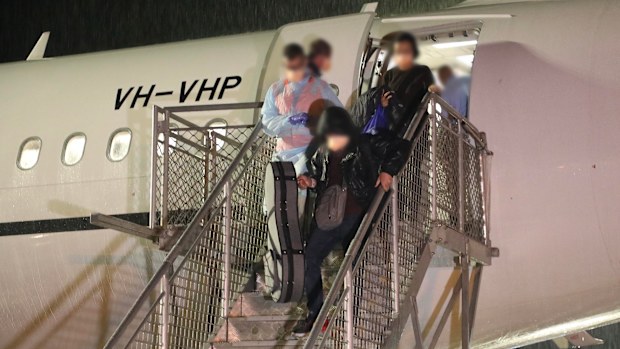 Passengers disembarking the plane at Christmas Island.