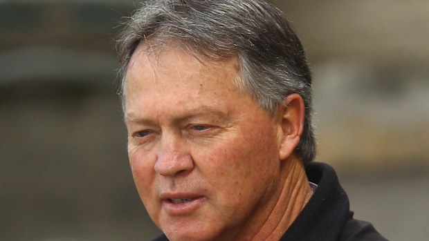 Bryan Cousins watches his son train in 2010. 