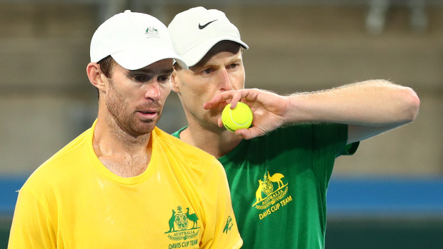 Luke Saville and  John Peers talk during a practice session ahead of the 2022 Davis Cup Qualifier.