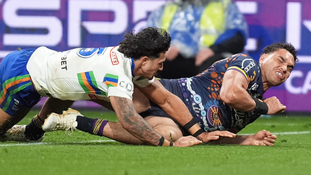 Xavier Coates grimmacing after suffering a hamstring injury while attempting to score a try in the Storm's win over the Raiders.