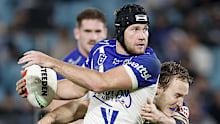 SYDNEY, AUSTRALIA - MAY 22: Matt Burton of the Bulldogs is tackled during the round 12 NRL match between Canterbury Bulldogs and Melbourne Storm at Accor Stadium, on May 22, 2026, in Sydney, Australia. (Photo by Darrian Traynor/Getty Images)