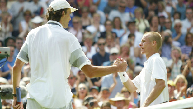 Ivo Karlovic and Lleyton Hewitt shakes hands after their famous 2003 Wimbeldon clash.
