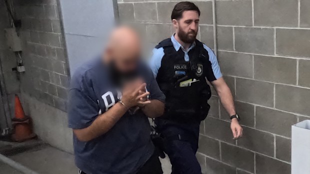 Two men, a staff member and a contractor, have been arrested for allegedly stealing almost $1.4 million intended for schools in Sydney. 