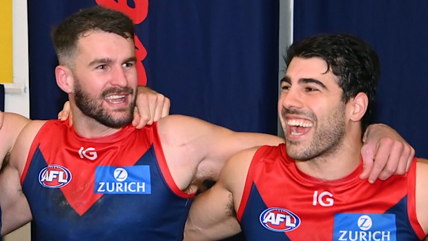 Joel Smith and Christian Petracca of the Demons sing.