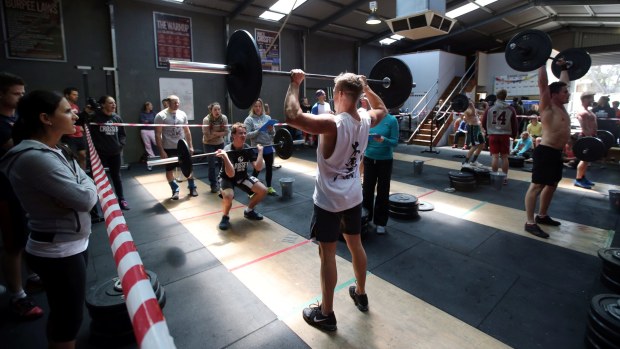 Workout junkies flock to CrossFit, hurting fitness centres