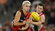 Matt Guelfi is tackled by opponent Jack Sinclair.