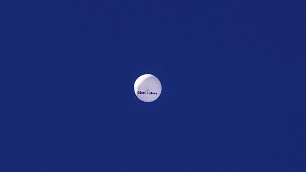 In this photo provided by Chad Fish, a large balloon drifts above the Atlantic Ocean, just off the coast of South Carolina.