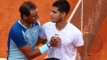 The Spaniards embrace at the net after the teen's three set victory.