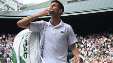 LONDON, ENGLAND - JULY 02: Novak Djokovic of Serbia celebrates match point win with the fans after beating Denis Kudla of USA during their men's singles third Round match on Day Five of The Championships - Wimbledon 2021 at All England Lawn Tennis and Croquet Club on July 02, 2021 in London, England. (Photo by Mike Hewitt/Getty Images)
