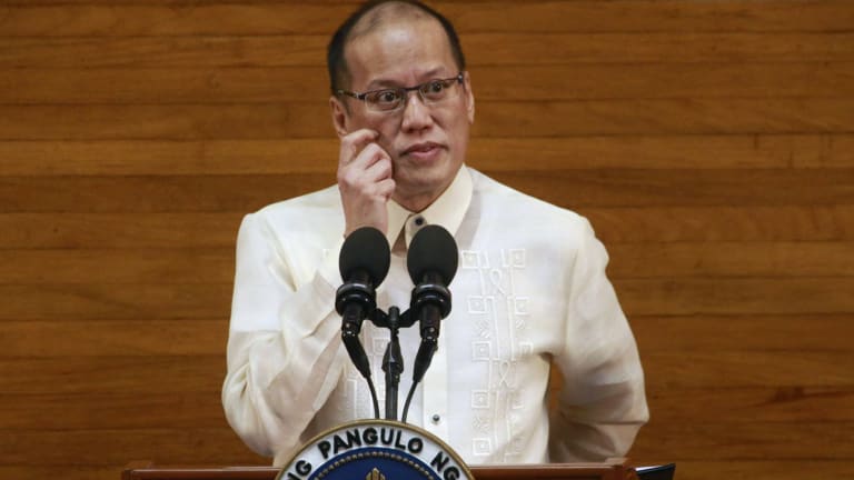 Phillippines President Benigno Aquino touts his successes as thousands demonstrate outside