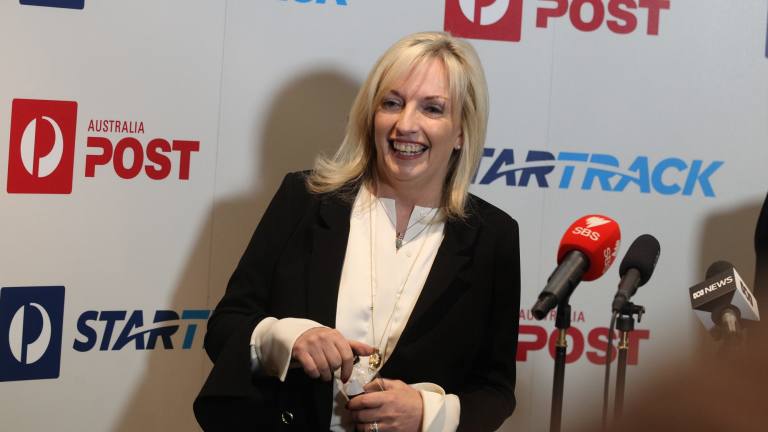 New Australia Post boss Christine Holgate shows Ahmed ...
