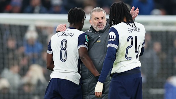 Tottenham manager Ange Postecoglou celebrates with Yves Bissouma and Djed Spence after the Carabao Cup semi final first leg match against Liverpool at Tottenham Hotspur Stadium on January 08, 2025 in London, England. (Photo by Harry Murphy - Danehouse/Getty Images)