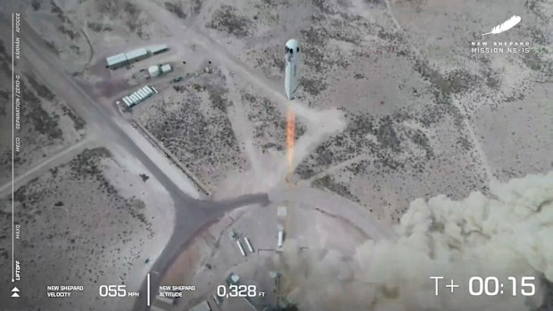 The New Shepard rocket lifts off during a test flight in April.