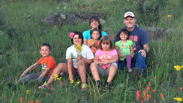 Brenda and Curt Heuer adopted the five siblings. (Supplied)