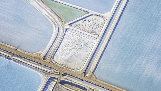 Aerial photo taken from a small plane showing a salt works and salt working Useless Loop, Shark Bay, Western Australia