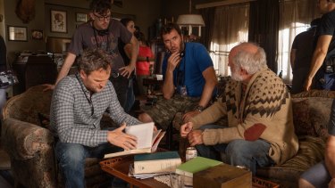 Clarke (left) on the set of Pet Sematary with directors Kevin Kolsch and Dennis Widmyer and co-star John Lithgow. 
