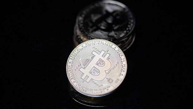 This photograph taken on April 26, 2021 in Paris shows a physical imitation of the Bitcoin crypto currency.  