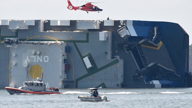 The Coast Guard rescued four crew members trapped on the ship. 
