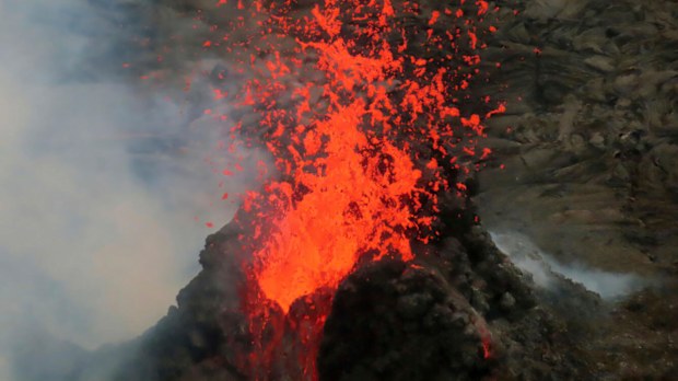 Lava erupts within the summit crater of Kilauea Volcano in Hawaii Volcanoes National Park on Hawaiis Big Island. 
