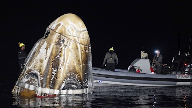 Three NASA astronauts and one Russian cosmonaut were unexpectedly transferred to a medical facility in Florida rather than returning to their home base in Houston after their splashdown early Friday morning aboard a SpaceX Crew Dragon capsule.