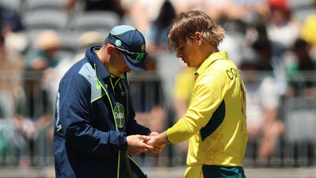 Cooper Connolly of Australia leaves the field injured during game three of the Men's ODI series between Australia and Pakistan.