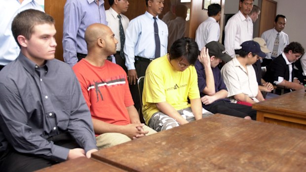 Seven of nine Australian drug smuggling suspects, from left to right, Scott Rush, Myuran Sukumaran, Tanduc Tan Nguyen, Matthew Norman, Andrew Chan, Si Yi Chan and Renae Lawrence sit att he prosecutors office in Denpasar, Bali, Indonesia, Monday, Aug. 15, 2005. Police have handed over their case filed to the prosecutors office, indicating that the nine could go on trial in the coming weeks. (AP Photo/Firdia Lisnawati)