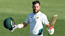 Caleb Jewell celebrates his ton. 