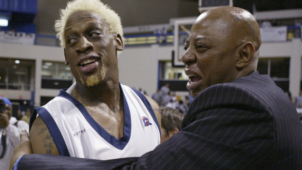 Dennis Rodman gets a hug from Earl Cureton.