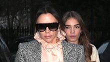Hana Cross walks behind Victoria Beckham in London in January 2019.