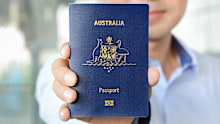 A man showing passport (of Australia)