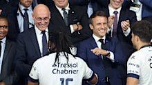 President of French Rugby Federation FFR Bernard Laporte (left) with French President Emmanuel Macron during the trophy ceremony following the Top 14 Final rugby match at Stade de France.